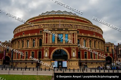 London, England - October 2025: The circular red-brick and terracotta facade of the Royal Albert Hall stands beneath an overcast sky in South Kensington.
